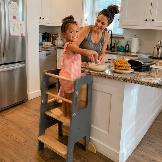 Wooden learning tower designed for toddlers to explore everyday activities independently